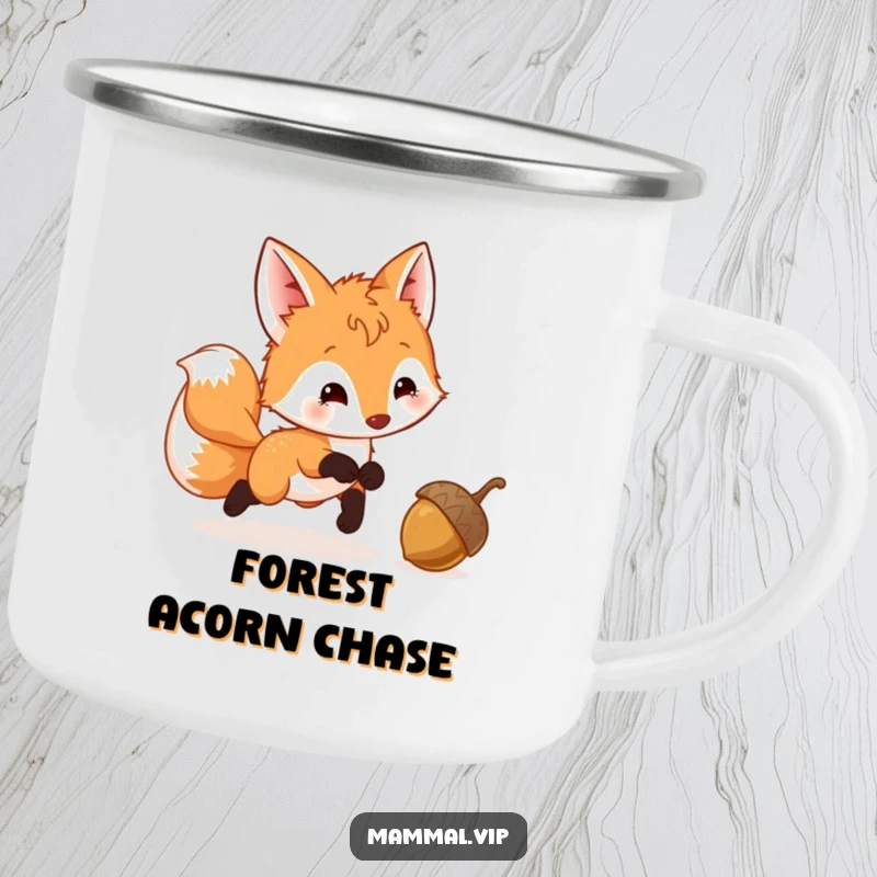 Funny Fox Cub Camping Mug showing a playful cub with a wagging tail chasing a bouncing acorn, ideal for outdoor beverages.