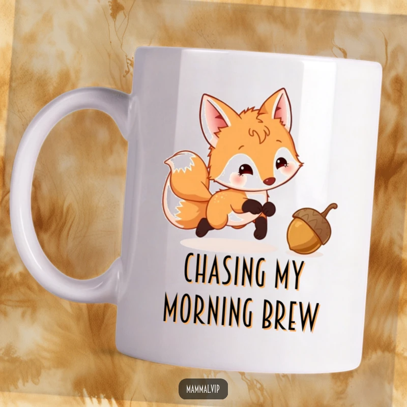 Funny Fox Cub Mug showing a playful cub with a wagging tail, excitedly chasing a bouncing acorn through the woods.