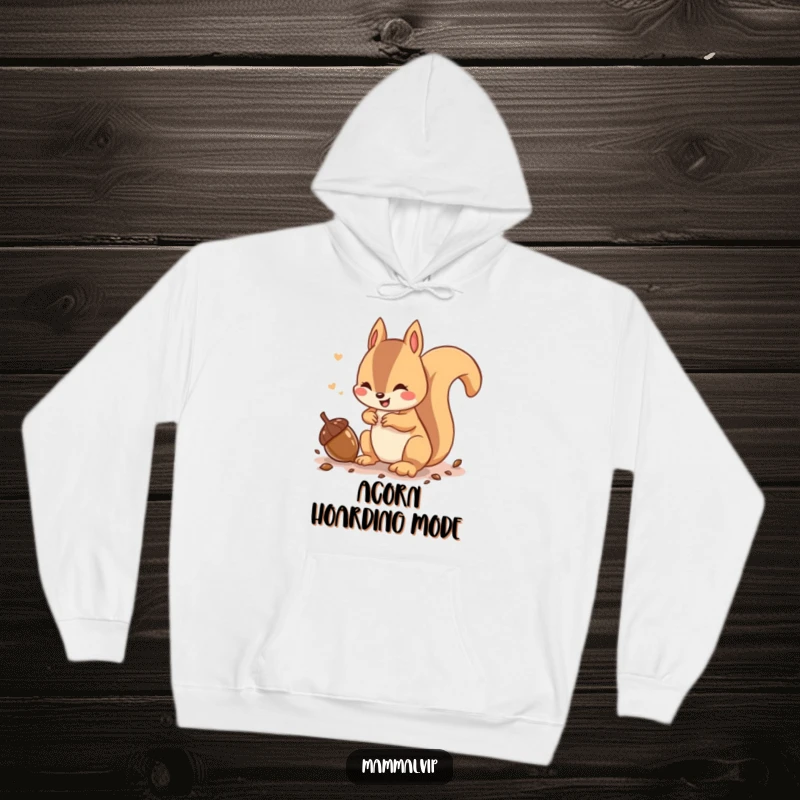 Funny hoodie featuring a playful squirrel character chattering while burying an acorn, perfect for cozy woodland vibes.