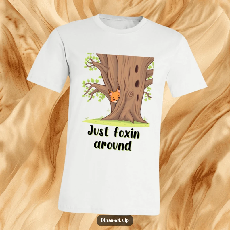 Funny t-shirt with a curious fox kit peeking playfully from behind a large oak tree, perfect for animal lovers.