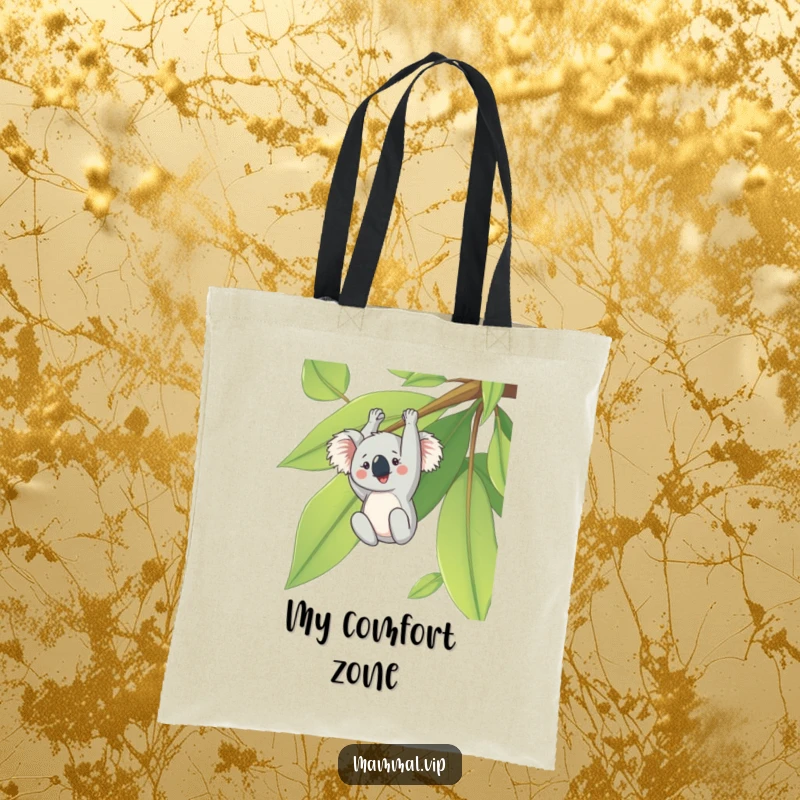 Funny tote bag with a cheerful koala character hanging upside down from a large eucalyptus leaf, a cute and humorous accessory.